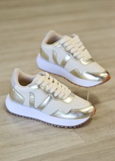 This nude/gold sneaker is a comfy & cute sneaker! Trendy Sneakers For Women, Gold Tennis Shoes, Tent Sale, Gold Sneakers, Cute Sneakers, Sneakers For Women, Trendy Sneakers, Hair Accessories Jewelry, Sneaker Wedge