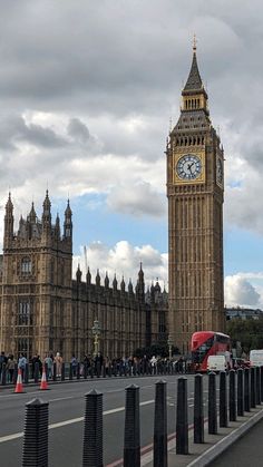 the big ben clock tower towering over the city of london on a partly cloudy day