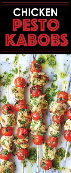 chicken kabobs on skewers with tomatoes and pesto garnish