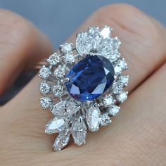 Certified 6.30CT (E-F / VS2-SI1) Oval, Round, and Marquise Cut Diamond and Blue Sapphire Engagement Ring in 18KT White GoldCenter: 1 oval cut blue sapphire weighing 3.50 caratSide Stones 1: 16 round cut diamonds weighing 1.00 caratSide Stones 2: 10 marquise cut diamonds weighing 1.80 caratGet inspired with our 6.30 ct diamonds and blue sapphire - engagement ring MDL#PSRI1177. This engagement ring is designed with 2.80 carat side diamonds. At Primestyle.com, we deal ONLY with 100% real, natural a Expensive Sapphire Engagement Ring, Luxury Sapphire Diamond Ring, Luxury Blue Marquise Cut Sapphire Ring, Luxury Engagement Ring, Luxury Stuff, Fancy Sapphire, Luxury Engagement Rings, Blue Sapphire Engagement Ring, Sapphire Stones