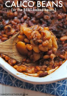 a wooden spoon full of baked beans in a casserole dish with text overlay