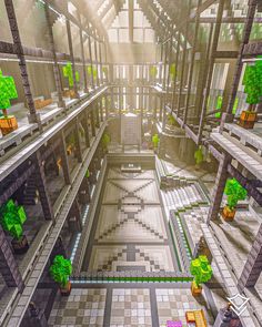 an aerial view of a building with lots of green plants and trees in the center