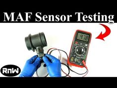 a person in blue gloves holding a meter and an electronic device with the words maf sensor testing on it