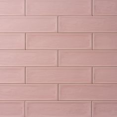 a pink brick wall is shown in this image