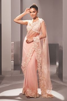 Pink saree with floral cutwork border. Paired with a cutwork sleeveless blouse and petticoat. - Aza Fashions Festive Pre-draped Saree With Lace Work For Designer Wear, Festive Pre-draped Saree With Lace Work, Traditional Designer Pre-draped Saree With Lace Work, Festive Pre-draped Saree In Georgette With Lace Work, Bollywood Style Pre-draped Saree With Lace Work, Festive Designer Pre-draped Saree With Lace Work, Anarkali Blouse Piece With Traditional Drape And Lace Work, Anarkali Blouse Piece With Traditional Lace Work, Anarkali Saree With Lace Work For Designer Wear