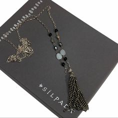 Silpada Sterling Silver 'Paint it Black' N3091 New! Never Worn! This Silpada necklace is a must-have for any jewelry collection.  Designed with luxurious 925 sterling silver, agate, hematite, pyrite, and a elegant tassel, this necklace will make you stand out from the crowd.  Its 36" long length adds style and sophistication, creating an eye-catching look perfect for a sophisticated evening outfit.  Its unique combination of natural and precious materials makes this necklace an alluring accessor Bohemian Silver Tassel Necklace Gift, Silver Bohemian Tassel Necklace As Gift, Silver Long Necklace With Adjustable Chain As Gift, Long Lariat Necklace With Tassels As A Gift, Tassel Long Necklace Jewelry For Gifts, Silver Long Necklace For Gift, Long Tassel Necklace Jewelry For Gift, Long Tassel Necklace As Gift, Long Tassel Necklace For Gifts