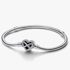 Brand New Bracelet. Charns Sells Separetely. Representing The Eternal Love That Binds Family Together, The Pandora Moments Sparkling Infinity Heart Clasp Snake Chain Bracelet Is A Meaningful Gift For The Ones That Matter Most To You. The Openwork Heart Clasp Features Stones Along The Edge And An Asymmetrical Infinity Symbol Entwining Around The Heart. The Back Of The Clasp Is Engraved With The Message "Family Forever And Always". The Bracelet Features Two Threaders (Raised Charm Dividers) Dividi Elegant Heart Bracelet With Charms, Elegant Infinity Charms Jewelry, Elegant Infinity-style Jewelry With Charms, Elegant Wedding Heart Bracelet With Charms, Elegant Heart Shaped Bracelets With Sterling Silver Clasp, Elegant Heart Bracelet With Lobster Clasp For Anniversary, Elegant Heart Bracelet With Lobster Clasp, Elegant Infinity Bracelets For Valentine's Day, Family Forever