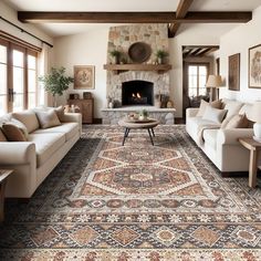 a living room filled with furniture and a large rug on the floor in front of a fire place