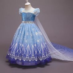 a blue and white dress with snowflakes on it