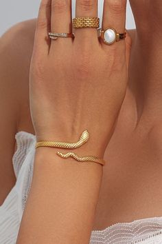 A woman wearing a gold snake wrap bracelet. Slithering Snake, Silversmithing Jewelry, Snake Jewelry, Snake Bracelet, Snake Design, Bracelet Women, Gold Snake, Affordable Jewelry, Pretty Jewellery