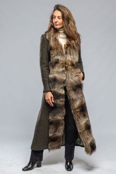 Over the last few years we have featured this coat in various fabrics and all have been fabulous. This year we chose to make it in a beautiful wool blend with nutria fur trim because we love the timeless elegance of this combination. 60% wool, 40% viscose Fully lined, fur trimmed Closure: Two hook-and-eye clasps 2 pock Warm Winter Outfit, Fur Trimmed Coat, Turtleneck Under, Fur Trim Coat, Winter Outfits Warm, Chic Scarves, Fall Wardrobe Essentials, Fitted Coat, Long Sweater Dress