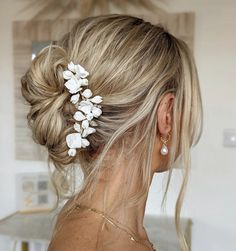 The Floryn bridal hair vine will add just the right amount of gorgeous detail to your bridal hair style. A fresh and modern arrangement of handmade clay flowers, and delicate crystals. Wear in a soft low bridal bun, a perfectly imperfect bridal ponytail, or beautiful loose tousled waves. #bridalhairvine #bridalheadpiece #bridalhairaccessories #bridalhairpiece #floralbridalheadpiece #bridetobe #bridalhairstyle #bridalupdo #bridalhalfuphalfdown White Floral Headpiece, Bridal Waves, Bridal Ponytail, Flower Hairpiece, Hairpiece Wedding, Floral Bridal Hair, Chic Ponytail, Bridal Floral Headpiece, Bridal Bun