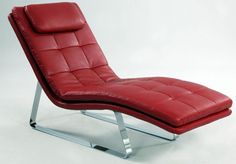 a red leather chaise lounge chair with chrome legs and footrests on an isolated white background