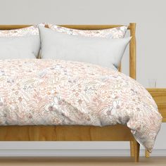 an image of a bed with pillows on it