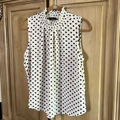 Women’s Sleeveless Top Ny Invasion Polka Dot Sleeveless Tank Top, Chic Polka Dot Tank Top For Spring, Spring Chic Polka Dot Tank Top, Fitted Polka Dot Sleeveless Blouse, Polka Dot Sleeveless Top For Work, Sleeveless Polka Dot Top For Work, Elegant Sleeveless Polka Dot Top, Polka Dot Sleeveless Casual Blouse, Casual Sleeveless Polka Dot Blouse