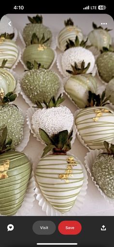 chocolate covered strawberries are arranged on a white tablecloth with gold leafy decorations