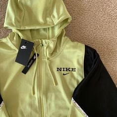 Nike Color Block Jacket. Zipped Jacket With Hood. Two Pockets. Women’s Jacket Color: Green And Black Size: Medium Nike Casual Outerwear With Zipper Closure, Casual Nike Outerwear With Zipper Closure, Nike Green Athleisure Outerwear, Green Sports Outerwear With Zipper Closure, Nike Green Hooded Track Jacket, Nike Green Track Jacket For Fall, Nike Green Hooded Jacket For Streetwear, Nike Outerwear With Zipper Closure For Winter, Nike Rain Jacket