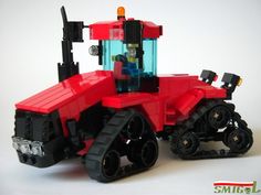 a red lego tractor is shown on a white background