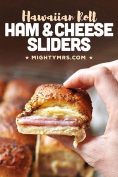 a ham and cheese slider being held up to the camera with text overlay