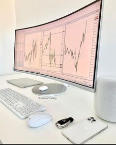 an apple desktop computer sitting on top of a white desk