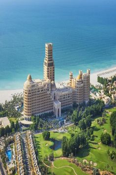 an aerial view of the resort and golf course in front of the ocean on a sunny day