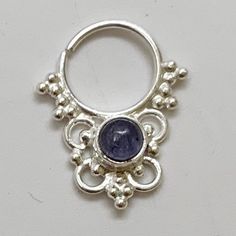 "These are soooooo pretty. Made is 925 sterling silver with tribal details, set with an alluring tanzanite stone. The rings are all 1cm (.40\") in diameter. The wire is 18 gauge. Each piece is made BY HAND so there may be very slight differences One of the images contains numbers to specify which you would like from the drop down menu." Sterling Silver Body Jewelry As Gift, Spiritual Silver Body Jewelry For Gift, Sterling Silver Body Jewelry, Unique Sterling Silver Body Jewelry Gift, Unique Sterling Silver Body Jewelry For Gifts, Silver Tanzanite Round Jewelry, Unique Sterling Silver Body Jewelry In Silver, Nickel-free Silver Amethyst Ring In Sterling Silver, Bohemian Silver Amethyst Ring In Sterling Silver