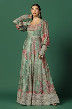 Green shaded anarkali crafted in chiffon with printed mughal motifs and gota, zari work embroidery detailing.
Components: 1
Pattern: Embroidery
Type Of Work: Gota and Zari work
Neckline: Wide V
Sleeve Type: Soft Puffed
Fabric: Chiffon, Lining: Shantoon
Color: Green
Other Details: 
Embroidered cuffs and border
Floral embroidery
Occasion: Mehendi and Haldi,Puja - Aza Fashions Chiffon Anarkali, Mehendi Dress, Chiffon Embroidery, Latest Bridal Lehenga, Mehendi Outfits, Indian Outfits Lehenga, Lehenga Designs Simple, Silver Embroidery, Traditional Indian Dress