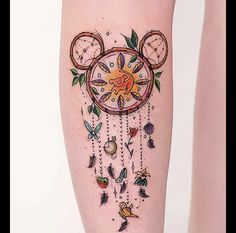 a woman's leg with tattoos on it