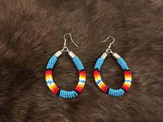 Authentic Beautiful Native American Indian Jewelry Navajo Zuni Hand Beaded  2 3/8inch Hoop Earrings Handcrafted by Navajo Artist Harriet Crosby Great for a  Gift❤️ Present in virtually every Native American tribe, the feather symbol is universally recognized as a representation of trust, strength, wisdom, freedom, and honor. Incorporated into many sacred pieces of Native American wear, the feather is easily one of the most respected symbols. Feather Symbol, Feather Symbolism, Hand Beaded Earrings, Indian Jewelry Earrings, Beaded Earrings Native, American Indian Jewelry, Native American Tribes, Native American Indians, American Indian