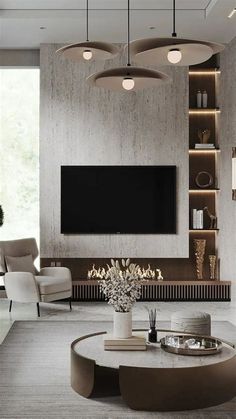 a living room with a large tv mounted on the wall