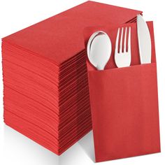 a stack of red napkins with forks and spoons