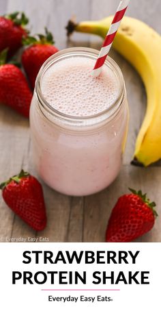 strawberry protein shake in a mason jar with strawberries on the side