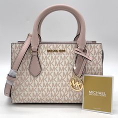 Brand New With Tag Michael Kors Sheila Small Satchel Shoulder Crossbody Bag Vegan Leather Gold Toned Hardware Color: Optic White/Rosegold 100% Authentic **Please See The Measurement For The Size** No Dust Bag Michael Kors Logo At Front 1 Mk Charm Zip Top Closure Triple Compartment With Center Zip Custom Fabric Lining 1 Slip-In Pocket 9" (Bottom) X 6.5"(H) X 3"(D) Straps: 3.5" Adjustable Strap: 20.25"-23.75" Bag Michael Kors, Michael Kors Satchel, Michael Kors Logo, Satchel Tote Bag, Handbag Pattern, Leather Satchel Bag, Luxury Bag, Satchel Tote, Orange Bag