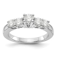 three stone engagement ring in white gold with diamonds on the sides and four stones at the top