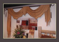 an image of a dining room setting with curtains