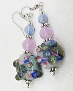 "This is a KIT for making a pair of earrings like those pictured. You will receive a bag with all of the components to make these earrings--it does not contain tools or instructions. If you need instructions, please message me to that effect when ordering. These are made with very simple and basic jewelry making techniques and can be made even by a novice quite quickly and easily. The focal beads are LAMPWORK/ARTISAN GLASS HANDMADE beads in gorgeous shades of green, blue, purple and taupe. They Multicolor Glass Beaded Earrings For Gift, Handmade Multicolor Glass Earrings, Glass Beaded Earrings For Gift, Handmade Glass Beaded Earrings As Gift, Nickel-free Multicolor Glass Earrings, Glass Round Bead Earrings As Gift, Glass Round Beads Earrings As Gift, Round Glass Bead Earrings As Gift, Adjustable Multicolor Glass Earrings