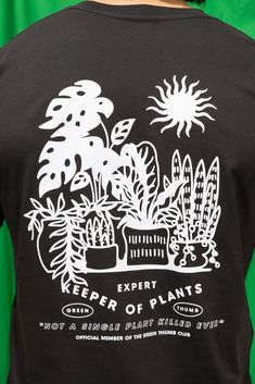 Introducing the Official Member of the Green Thumb Club Tee, a unisex style designed for those who proudly boast their expertise in plant care and eco-conscious living. Made from 100% combed cotton, this tee offers a relaxed fit and crew neck for all-day comfort. The statement "Expert Keeper of Plants" embellished on the shirt signifies your dedication and loyalty as a member of our Green Thumb Club. Unisex Style Crew neck 100% combed cotton Relaxed fit Note: BWH Merch is crafted in limited batc Grunge Tshirt Design, Tshirt Style Outfit, Grunge Tshirt, Plant Graphic, Plant Display Ideas, Shirt Display, Merch Ideas, Plant Display, Conscious Living