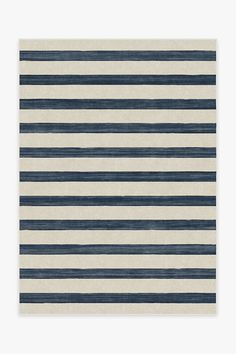 a blue and white rug with horizontal stripes