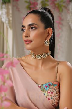 The floral Kundan choker necklace set is inspired by the rich Indian jewelry-making techniques handcrafted by the artisans to celebrate a perfect armor between ancient and modern concepts. The Indian Kundan necklace is an ode to the beautiful bride as she prepares to begin her new chapter of life. Pair this gorgeous replica of Bollywood jewelry with your ethnic or contemporary ensembles and create a look to remember. Necklace Closure - Adjustable Dori Earrings Closure - Push Back Style Tip - The Luxury Kundan Necklace With Cutdana, Handmade Gold Bridal Necklace For Reception, Reception Tilla Choker, Traditional Choker Jewelry For Reception, Traditional Choker Jewelry For Receptions, Tilla Choker For Reception, Tilla Choker For Reception Occasion, Tilla Choker Jewelry For Reception, Handmade Elegant Jewelry For Reception