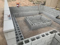 cinder blocks laid out in the middle of a construction site for a house to be built