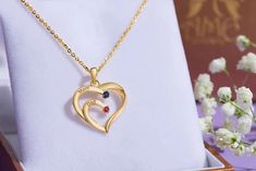 Diamond Ruby Sapphire Family Heart Pendant in 14K Gold | AME Jewellery Fine Jewelry Heart Necklace With Birthstone, Yellow Gold Heart Necklace With Birthstone For Anniversary, Gold Heart Necklace With Gemstone For Anniversary, Heart-shaped Fine Jewelry Necklace For Mom, Fine Jewelry Heart Necklace For Mom, Fine Jewelry Heart Necklace Gift, Gold Double Heart Gemstone Necklace, Gold Double Heart Gemstone Necklaces, Gold Heart Necklace With Gemstone For Gift