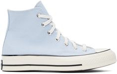 High-top canvas sneakers in blue. · Rubber cap toe · Lace-up closure · Logo patch and eyelets at inner side · Cushioned Ortholite® footbed · Canvas lining · Rubberized logo patch at midsole · Treaded rubber sole · Contrast stitching in white Supplier color: Cloudy daze/Egret/Black Converse Wishlist, Blue Chuck 70, Pastel Converse, Baby Blue Converse, Bts Clothes, Chuck 70 High Top, Dream Shoe, Light Blue Shoes, Cute Converse