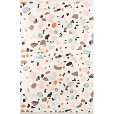 a white rug with multicolored spots on the front and back of it,