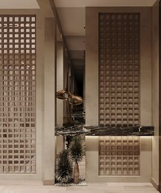 the interior of a hotel lobby with marble flooring and decorative wall panels on the walls