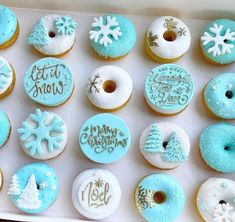 a box filled with frosted donuts covered in icing