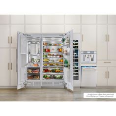 an open refrigerator and freezer combo in a kitchen