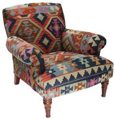 a colorful patterned chair with wooden legs