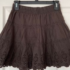 Gap Dark Brown Eyelet Mini Flowy Ruffle Skater Circle Skirt New With Tags/ Never Worn Originally $45 Gap Teen Size 12 But Can Also Fit A Size 00, 0, 24, 25, Or Xs In Women’s See Photos For Approximate Measurements Waistband Stretches And Can Get Bigger Than The Measurement In The Photo Double-Layer With An Extra Lining Inside The Skirt Boho, Bohemian, Coquette, Eyelet, Casual, Preppy, Dressy, Formal, Everyday, High Rise Skirt, Mid Rise Skirt, Summer, Spring, Vacation, Cruise, Beachy, Ruffle Skir Flay Skirt, Mid Rise Skirt, Velvet Skater Skirt, Flared Denim Skirt, Blue Pleated Skirt, Brown Mini Skirt, Floral Skater Skirt, Mini Skater Skirt, Fairy Skirt