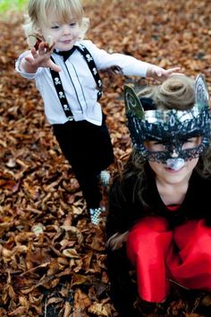 Bridesmaid and Page Boy in woods playing with autumnal leaves. Check out their Halloween and Rockabilly inspired wedding for more inspiration on fashion, table centres, decor, kill booth and more! Kids Playing, Carnival Face Paint, Twist