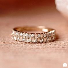 a wedding band with three rows of diamonds